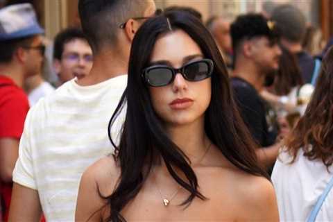 Dua Lipa wears cutout pants and a corset top while sightseeing in Florence